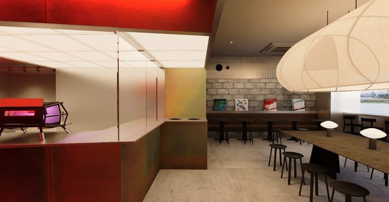 Baby Crosta communal table under a large pendant