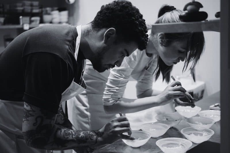 Chef breaking down produce at the pass