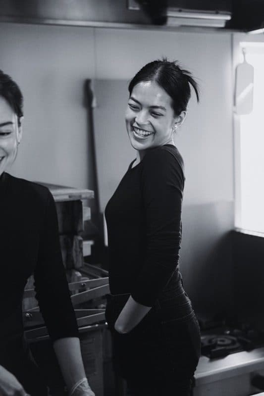 Team member smiling in the workspace