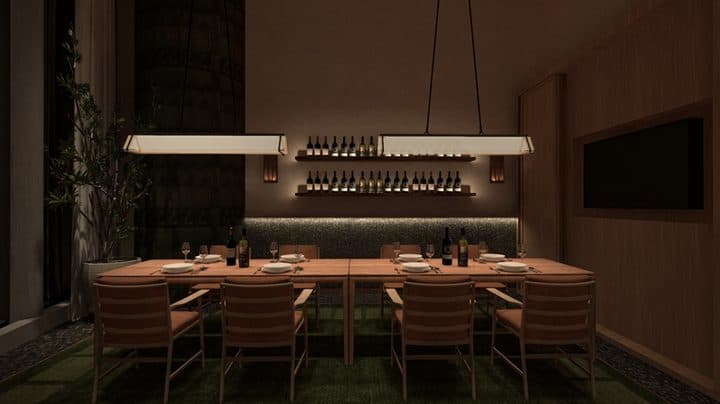 LUME private dining table beneath a long linear pendant